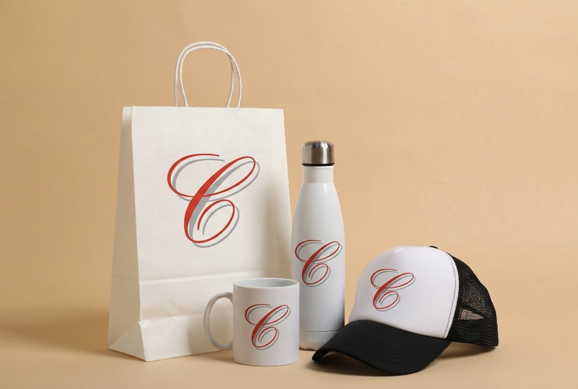 A branded shopping bag, branded coffee mug, branded drink bottle and branded cap.